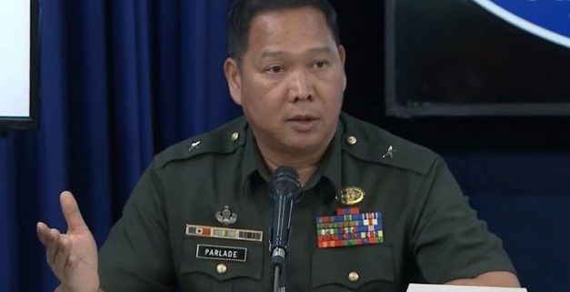 Gate-crashing general booed out of forum by his red-baiting victims