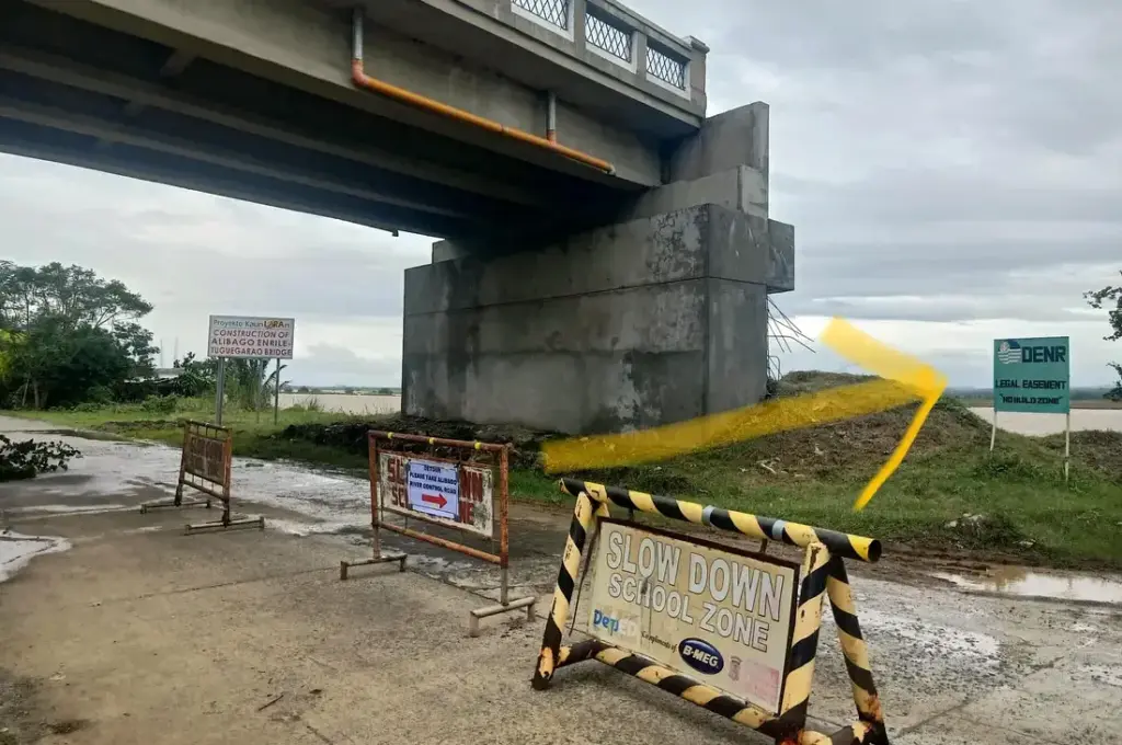 NOWHERE. Road barricades litter the highway in Enrile town in Cagayan, cautioning motorists about passing underneath an overpass bridge project of the DPWH that, locals said, leads to nowhere. (Courtesy of Enrile LGU)